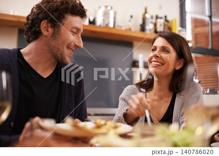Couple, food and table for love in home, conversation and healthy meal in apartment for anniversary. Happy people, bonding and eating together on weekend, relax and speaking on romantic dinner date Couple, food and table for love in home, conversation and healthy meal in apartment for anniversary. Happy people, bonding and eating together on weekend, relax and speaking on romantic dinner date 140786020