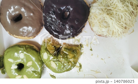 Assorted Sweet Doughnuts with Various Toppings in Delivery Box 140786025