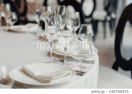 Empty table set with elegant glassware Empty table set with elegant glassware 140786935