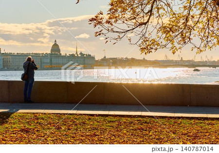 Russia, St.Petersburg, the drawbridge of the Palace at sunset, University embankment, cars traffic, the cabinet of curiosities museum, rostral columns, cranes of shipyard Russia, St.Petersburg, the drawbridge of the Palace at sunset, University embankment, cars traffic, the cabinet of curiosities museum, rostral columns, cranes of shipyard 140787014