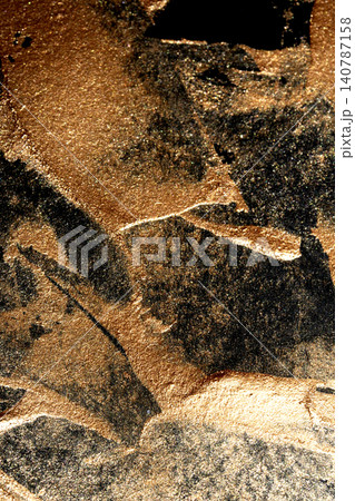 Gold metallic paint brush smear stroke golden bronze color stain shiny glittering textured background Gold metallic paint brush smear stroke golden bronze color stain shiny glittering textured background 140787158