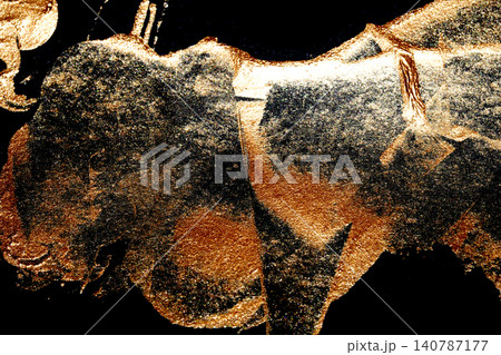 Gold metallic paint brush smear stroke golden bronze color stain shiny glittering textured background 140787177