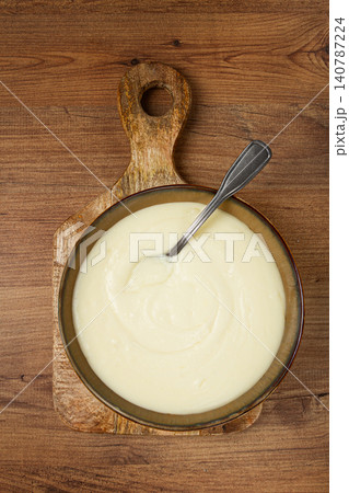 Mashed potatoes, with suluguni cheese, homemade, on a wooden table, no people, top view, Mashed potatoes, with suluguni cheese, homemade, on a wooden table, no people, top view, 140787224
