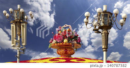 Street lamp and huge flower basket (against the background of a beautiful sky with clouds) in Tiananmen square, Beijing, China Street lamp and huge flower basket (against the background of a beautiful sky with clouds) in Tiananmen square, Beijing, China 140787382