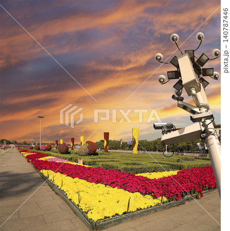 Street lamp on Tiananmen Square in Beijing, China (against the sunset), with propaganda or public announcement speakers Street lamp on Tiananmen Square in Beijing, China (against the sunset), with propaganda or public announcement speakers 140787446