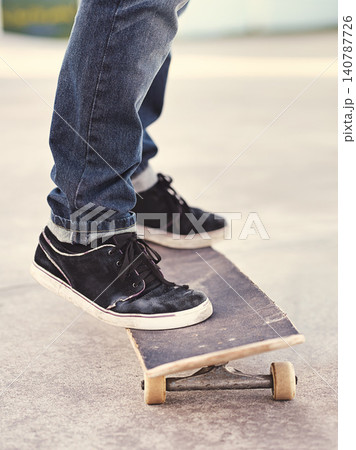 Closeup, shoes and skateboard with energy, person and fitness with performance and hobby with skill. Skater, outdoor or summer with sneakers, cardio or sunshine with talent or balance with recreation 140787726