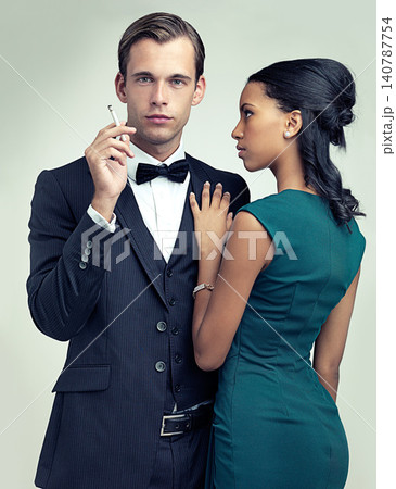 Fashion, smoking and portrait for couple, vintage and style for cosplay and trend for classic and classy. Diverse people and gentleman with girlfriend and cigarette for confident, rich and luxury 140787754