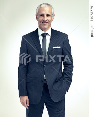 Business man, smile and portrait in studio for professional, career and corporate for job and style indoor. Mature person, trader or executive and happy with suit for confidence and work 140787791