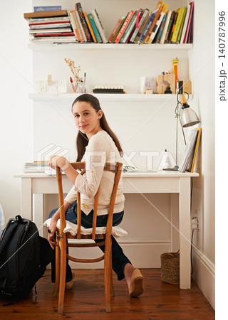 Portrait, student and girl with ideas, homework and education with learning and knowledge. Person, study room and child development with ideas and sitting with deadline and books with schedule Portrait, student and girl with ideas, homework and education with learning and knowledge. Person, study room and child development with ideas and sitting with deadline and books with schedule 140787996