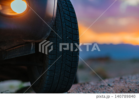 Car wheel offroad closeup view at twilight Car wheel offroad closeup view at twilight 140789840