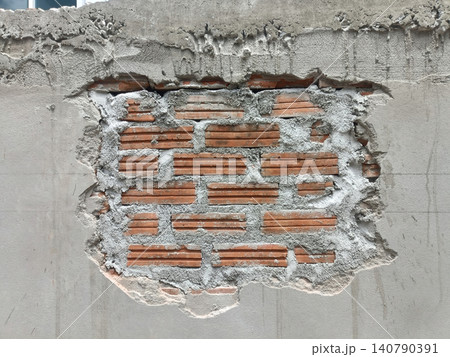 Exposed brick, damaged wall, cement, plaster with rough construction texture Exposed brick, damaged wall, cement, plaster with rough construction texture 140790391