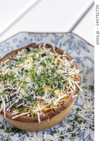 Mini Quiche Lorraine with bacon, mushroom and cheese on vintage plate Mini Quiche Lorraine with bacon, mushroom and cheese on vintage plate 140792730