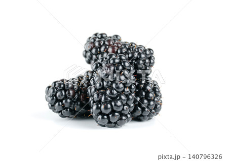 A small pile of ripe blackberries with glossy dark skins, isolated against a clean white background with soft studio lighting and visible texture A small pile of ripe blackberries with glossy dark skins, isolated against a clean white background with soft studio lighting and visible texture 140796326
