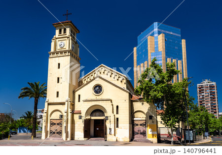 View of the historic Military Cathedral of Our Lady of Mount Carmel facade and bell tower against a modern skyscraper in the Providencia district of Santiago, Chile View of the historic Military Cathedral of Our Lady of Mount Carmel facade and bell tower against a modern skyscraper in the Providencia district of Santiago, Chile 140796441