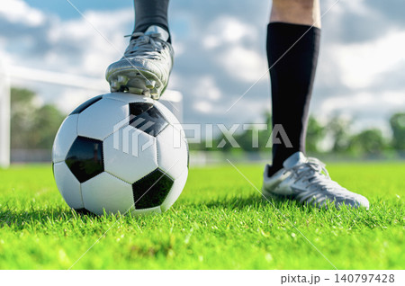Silver Football Boot POV, Soccer Ball Control Concept, Athlete Foot on Field Media Asset 140797428