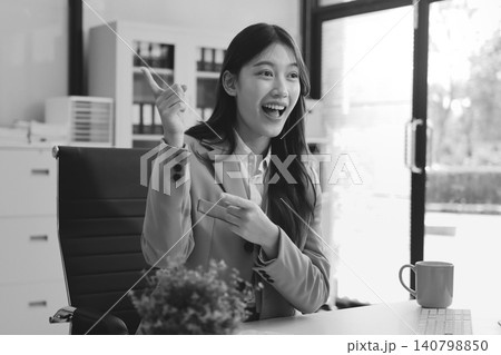 Young businesswoman professional employee using pc doing online banking analysing at workplace. Asian middle-aged business woman working on laptop computer in office, taking notes. Banner, copy space 140798850