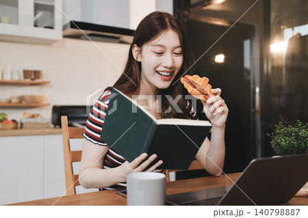 Asian woman using computer remote for business studying, watching online virtual webinar training meeting, video call. asian business woman talking on laptop in home office. Banner, copy space Asian woman using computer remote for business studying, watching online virtual webinar training meeting, video call. asian business woman talking on laptop in home office. Banner, copy space 140798887