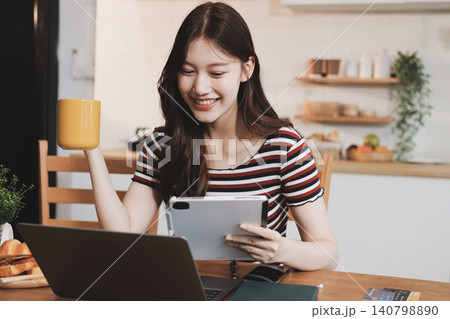 Asian woman using computer remote for business studying, watching online virtual webinar training meeting, video call. asian business woman talking on laptop in home office. Banner, copy space 140798890
