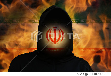 Iran state terrorism and war concept with anonymous hooded silhouette on burning Iranian flag background. Terrorist threat, military conflict or geopolitical danger metaphor Iran state terrorism and war concept with anonymous hooded silhouette on burning Iranian flag background. Terrorist threat, military conflict or geopolitical danger metaphor 140799060
