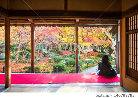 Japanese woman on Enkoji hall terrace view autumn garden, Kyoto Japanese woman on Enkoji hall terrace view autumn garden, Kyoto 140799793