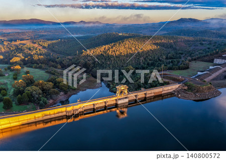 Aerial view showcasing the Lake Keepit dam wall and surrounding rural landscape, highlighting the scale of the reservoir, engineering infrastructure and tranquil lakeside setting in NSW, Australia. Aerial view showcasing the Lake Keepit dam wall and surrounding rural landscape, highlighting the scale of the reservoir, engineering infrastructure and tranquil lakeside setting in NSW, Australia. 140800572
