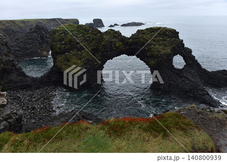 Gatklettur basalt rock arch on the coast of Arnarstapi, Iceland Gatklettur basalt rock arch on the coast of Arnarstapi, Iceland 140800939
