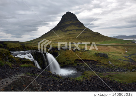 Kirkjufellsfoss waterfall cascading with Kirkjufell mountain in the background, Iceland Kirkjufellsfoss waterfall cascading with Kirkjufell mountain in the background, Iceland 140803038