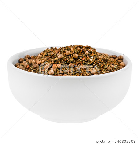 Side view of mixed spices with coriander seeds in a white bowl isolated on white background Side view of mixed spices with coriander seeds in a white bowl isolated on white background 140803308