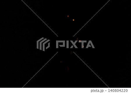 Shallow focus of fire sparks over black background 140804220
