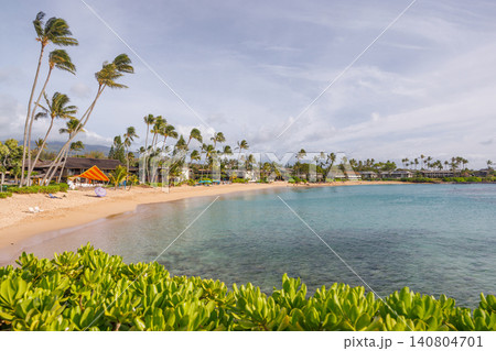 Sunny resort in Hawaii with golden sand, clear blue water under a bright sky 140804701