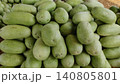 Long light green watermelons on dry grass 140805801