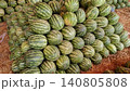 Striped green watermelons piled for sale in wholesale fruit market 140805808