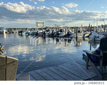 Boats on Water at Marina Under a Blue Sky With Clouds at Golden Hour 140805813