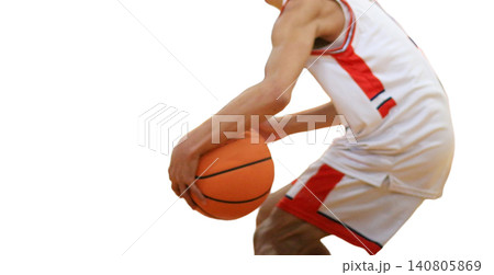 Basketball Player Prepares to Shoot Basketball During a Game in a Gym Basketball Player Prepares to Shoot Basketball During a Game in a Gym 140805869