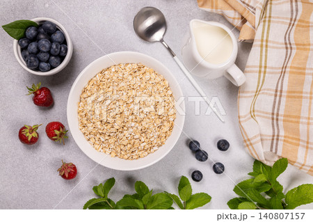 Oatmeal ingredients ready for a healthy berry breakfast Oatmeal ingredients ready for a healthy berry breakfast 140807157
