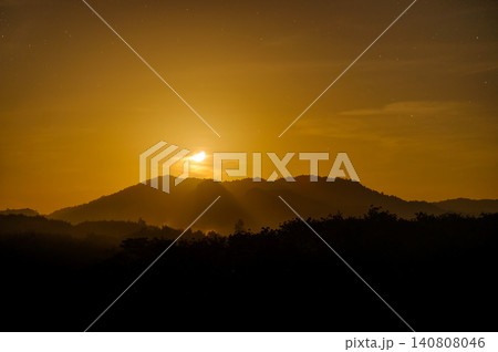 moonlight in the blue clear sky with a silhouette foreground of a forest and hill moonlight in the blue clear sky with a silhouette foreground of a forest and hill 140808046