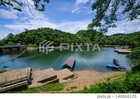 an area above the dam that is filled with water and has many floating building such as guesthouse restaurants and others an area above the dam that is filled with water and has many floating building such as guesthouse restaurants and others 140808120