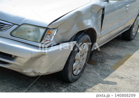 a scared marks on a front-left car body from accidentally hit by fast drive motorcycle, show broken mirror of flashlight cover a scared marks on a front-left car body from accidentally hit by fast drive motorcycle, show broken mirror of flashlight cover 140808209