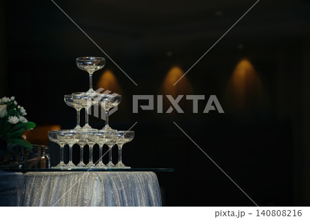 small tower of champagne's glass in wedding reception party small tower of champagne's glass in wedding reception party 140808216