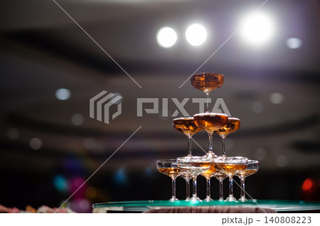 small tower of champagne's glass in wedding reception party small tower of champagne's glass in wedding reception party 140808223