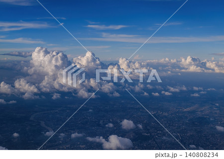 cityscape view from airplane with cloudy blue sky above, photo may has some noise cityscape view from airplane with cloudy blue sky above, photo may has some noise 140808234