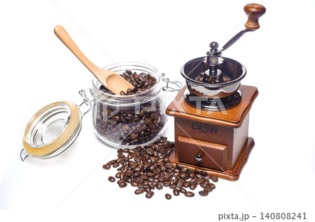 grounded coffee from the grinding machine with some coffee beans before grinded grounded coffee from the grinding machine with some coffee beans before grinded 140808241