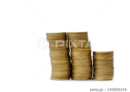 old & used golden coins stack up in white background 140808244