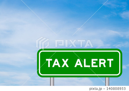 Green color transportation sign with word tax alert on blue sky with white cloud background Green color transportation sign with word tax alert on blue sky with white cloud background 140808933
