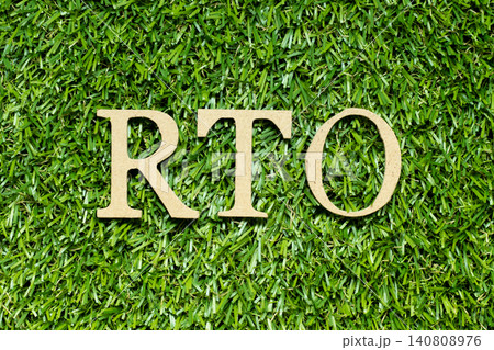 Wood alphabet letter in word RTO (abbreviation of recovery time objective) on green grass background Wood alphabet letter in word RTO (abbreviation of recovery time objective) on green grass background 140808976