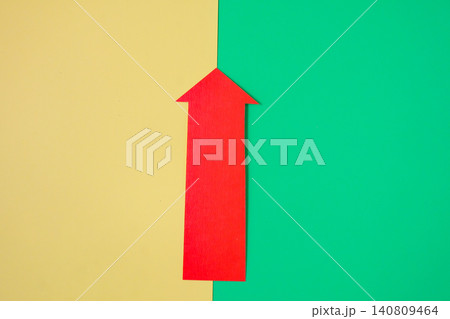 Red arrow pointing on color background. 140809464