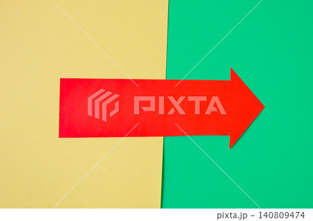 Red arrow pointing on color background. 140809474