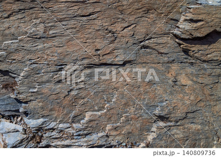 Close-up of Textured Rock Face with Stratified Layers 140809736