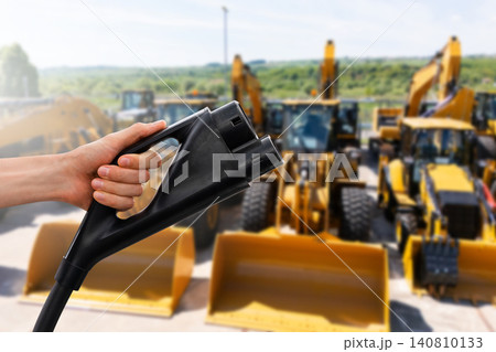 Electric construction machines with charging station. Concept. Electric construction machines with charging station. Concept. 140810133