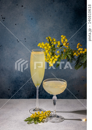 Mimosa cocktails with garnish celebrating spring season 140810618